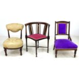 A group of three side chairs, comprising an Edwardian mahogany and inlaid corner chair, with pink