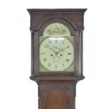 An early 19th century oak long case clock, by Jas Large, Wymondham, the painted arch dial with