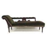 An Edwardian stained oak chaise longue, 176 by 61.5 by 71cm high.