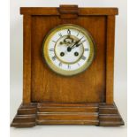 A mahogany mantel clock, the Art Deco case fitted with a 19th century French movement, 8 day