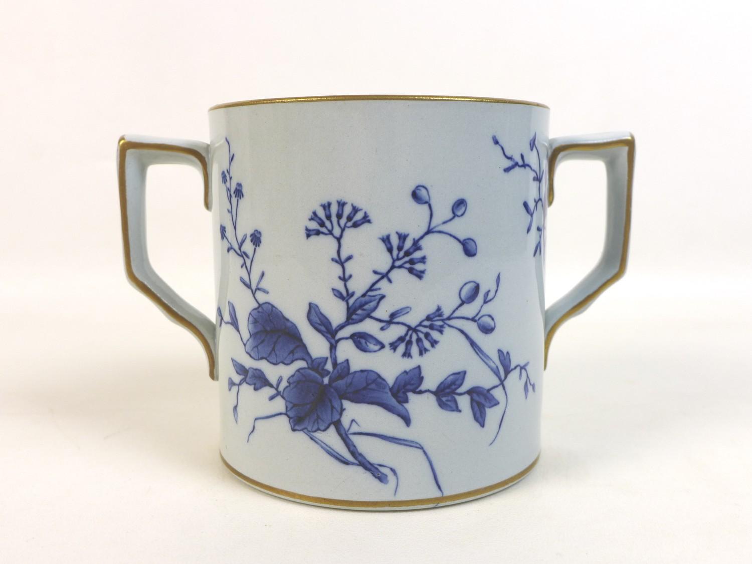 A 20th century Japanese blue and white twin handled tankard, with gilt decoration to rim and