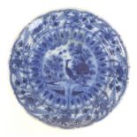 A Dutch blue and white tin glazed charger, with wax stamp to its base, 35 by 6cm high.