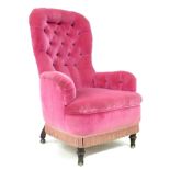 An unusual French 19th century spoon back armchair, recently upholstered in pink velvet, the