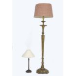 A giltwood and gesso standard lamp of tapering fluted form, raised on a double florette base,