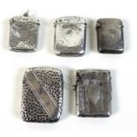 A group of five Victorian and later silver vesta cases, all of rectangular form with hinged lids