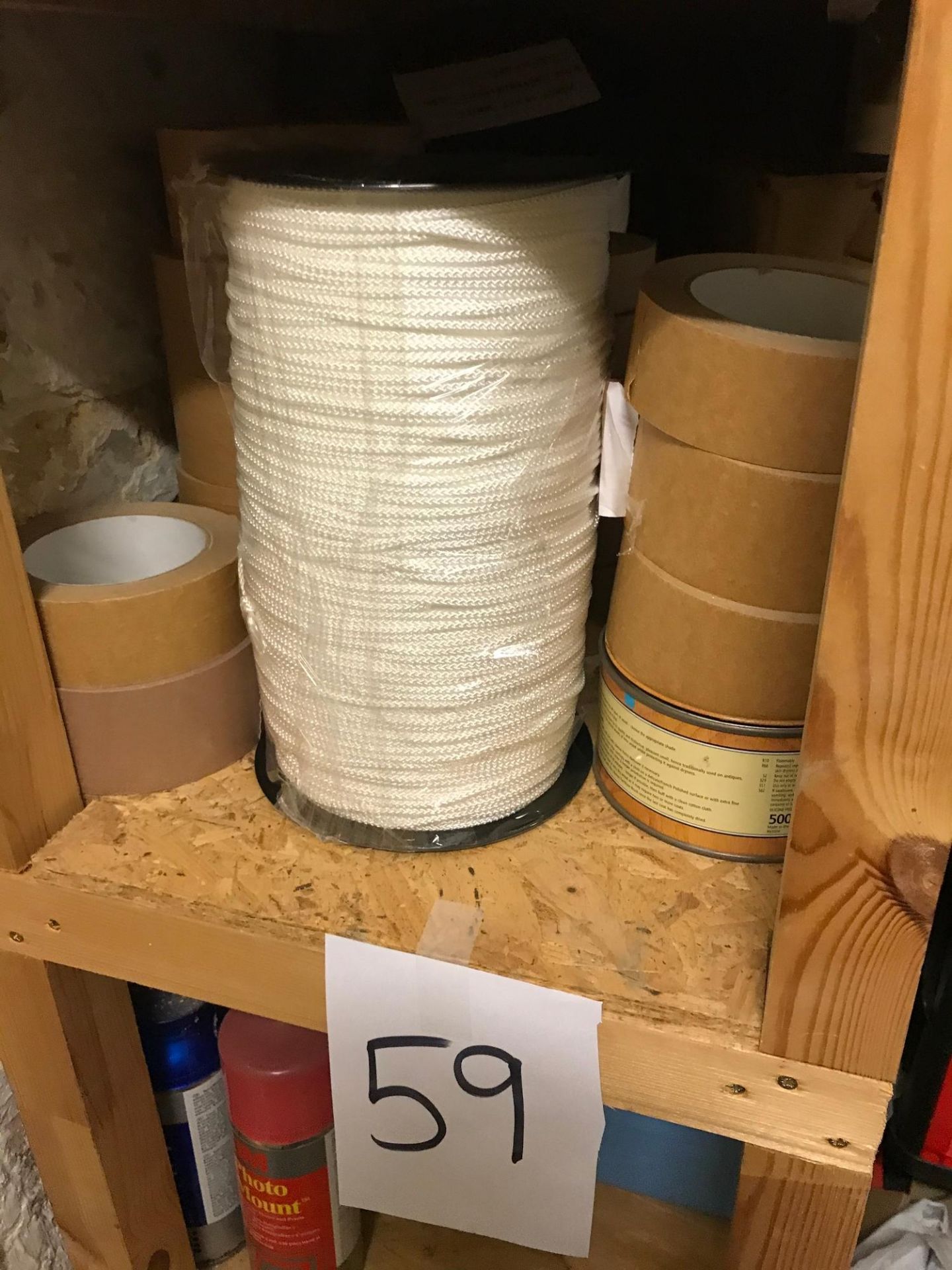 Shelf of tape and cord.