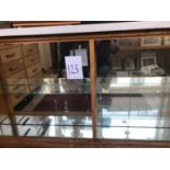 Oak framed glass fronted mirror shop cabinet.