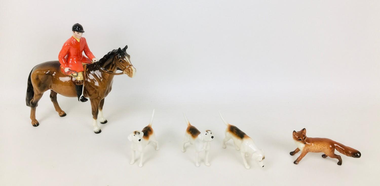 A group of Beswick fox hunting figurines, comprising huntsmen seated upon a horse, 23 by 8 by 21cm