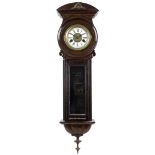 A 19th century mahogany wall clock, with narrow case, and brass crest to domed top, with pendulum