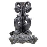 An unusual 19th century carved oak pedestal table base, carved in sections with inverted beasts