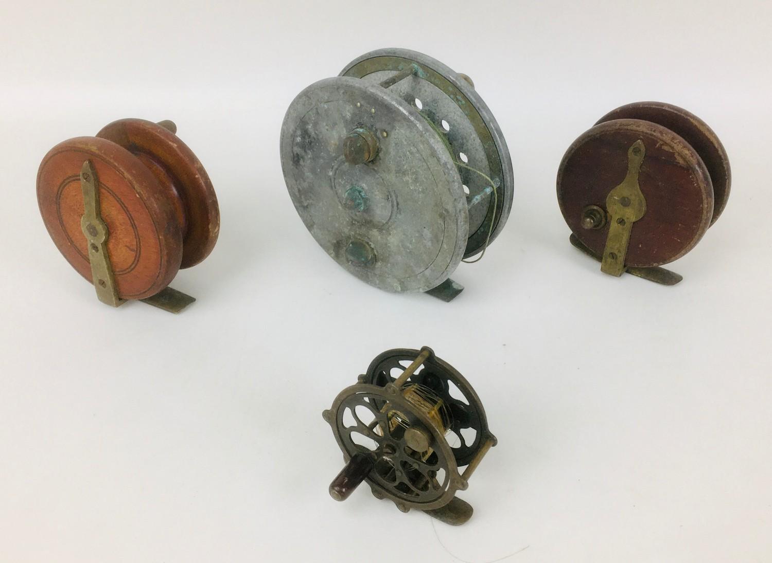 Four vintage fly fishing reels, including a Wilkes Osprey, 3 1/2" spool, a D. Slater aluminium reel,