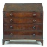 An early 19th century mahogany bureau