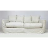 A modern three seater sofa, upholstered in white cotton, 208 by 101 by 90cm high.