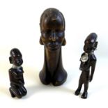 A early of likely mid 20th century African sculptures, comprising a pair of figures possibly