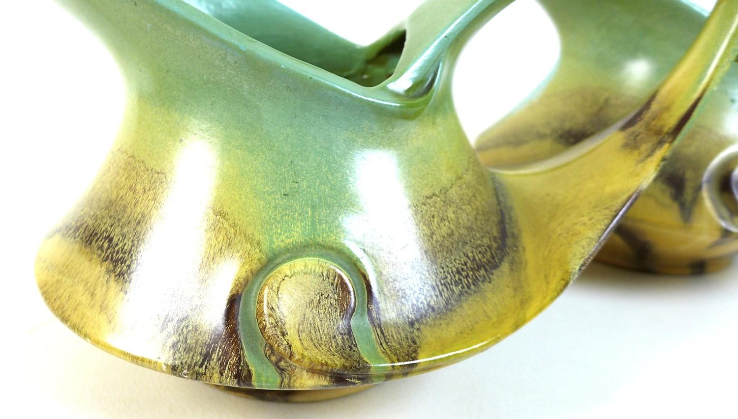 A pair of Dutch Art Deco jugs of squat curvilinear design with slip glaze in pale green, buff and - Image 2 of 7