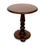 A Victorian mahogany occasional table, circular surface with moulded edge, raised on a turned column