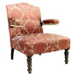A Victorian open armchair, with cantilever style padded arms, upholstered in pink foliate fabric, 68