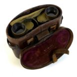 A pair of WWII military binoculars, brass and black leather covered, engraved markings ?Taylor-