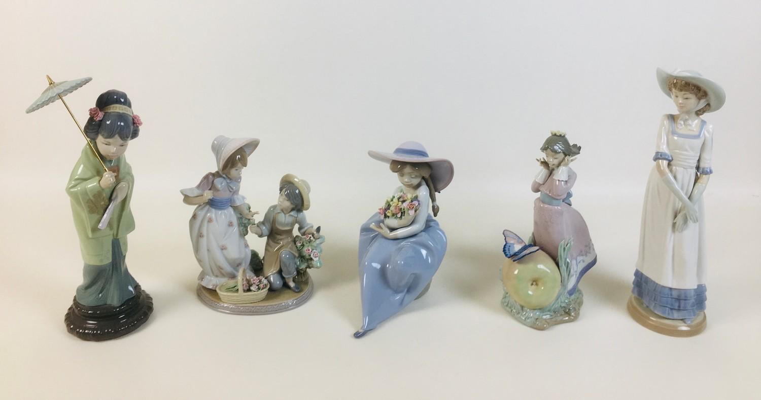 A group of four Lladro figurines, comprising a Lladro figural group 'For you' 5453, 'Fragrant