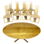 A fine contemporary oak bespoke handmade oval dining table, together with eight matching modern