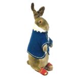An early 20th century Steiff soft toy of Beatrix Potter's Peter Rabbit, with a white shirt