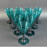 A set of ten Regency Bristol green wine glasses, with conical bowls and knopped stems, rough