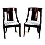 A pair of French Restauration Charles X flame mahogany side chairs, circa 1810, in the style of