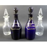 A pair of Georgian Bristol blue decanters and stoppers, with gilt painted ?labels? held by