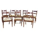 A set of eight Regency mahogany dining chairs, with line carved decoration,