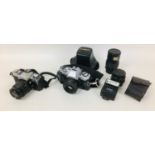 A collection of Minolta cameras and lenses, comprising a Minolta XD7 with MD W. Rokkor-X 28mm 1:2,