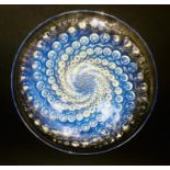 A Rene Lalique 'Volutes' clear and opalescent glass bowl, with spiralling dot design, signed 'R.