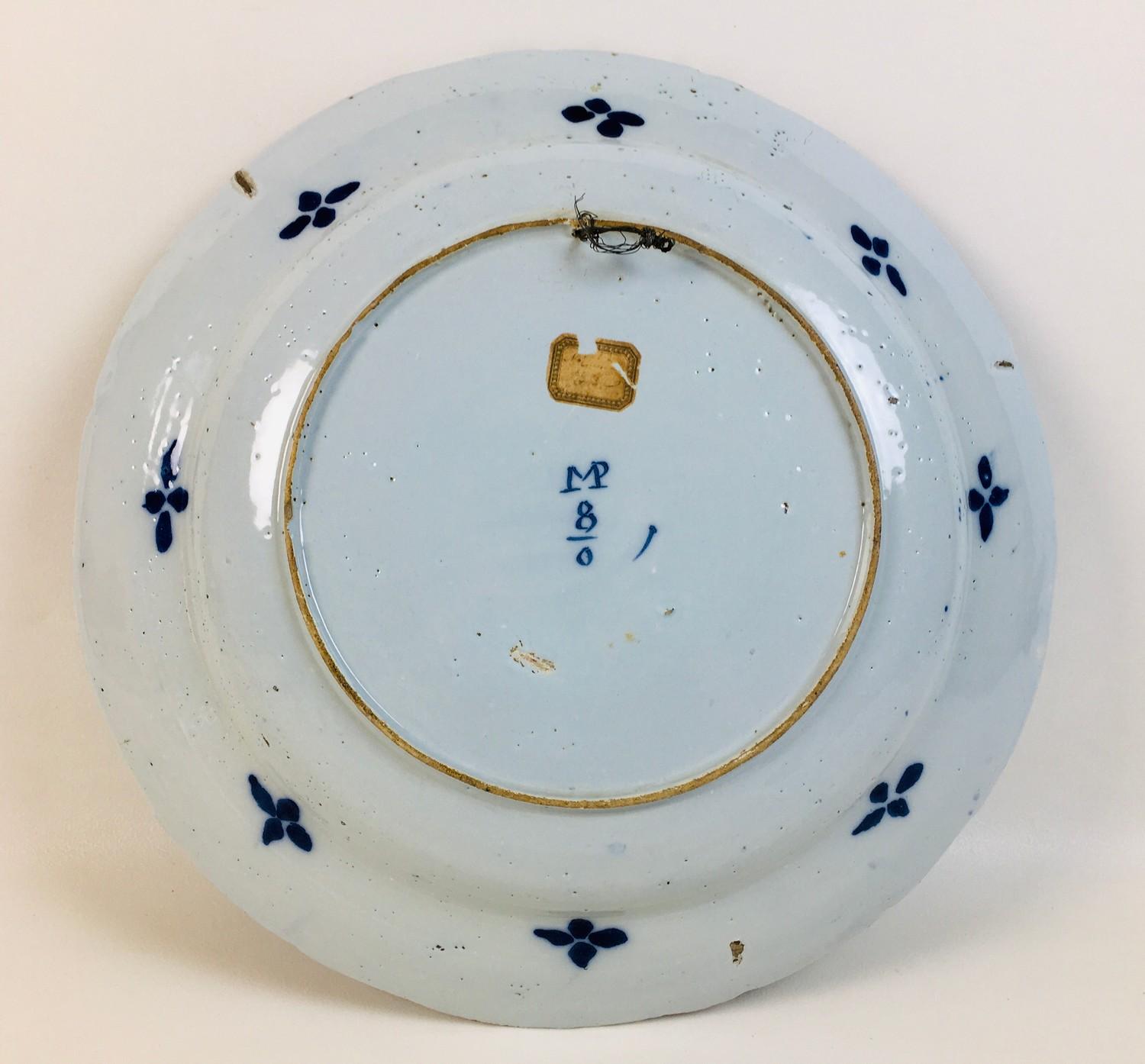 An 18th century Dutch blue and white tin glazed charger, decorated with three flower heads to the - Image 2 of 7