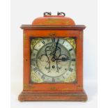 An early 20th century bracket clock, with red lacquered Chinoiserie case and pierced grill back,