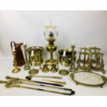 A collection of copper and brass items, including candlesticks, jardiniere, oil lamp, 58 by 20cm,