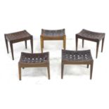 A group of five oak and leather strap seated stools, including one with front rail carved '19T33',