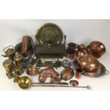A collection of copper, brass, and metal wares, including fish form jelly mould, brass ladle, lidded