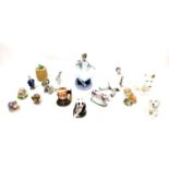A group of fourteen ceramics and figurines, comprising a Royal Crown Derby Panda paperweight with