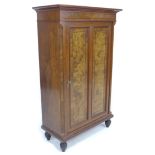 A 19th century Continental walnut cabinet, with burr walnut veneer and ebony stringing, the single