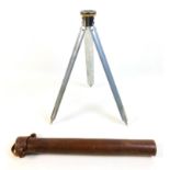 An early to mid 20th century French telescopic tripod, each of the three legs with five slides,