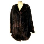 A vintage half length mink coat, labelled 'Serviced by Victor Segall, London', 85cm back length.