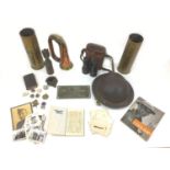A collection of WWII militaria, comprising a note book details wartime in experience in the army,