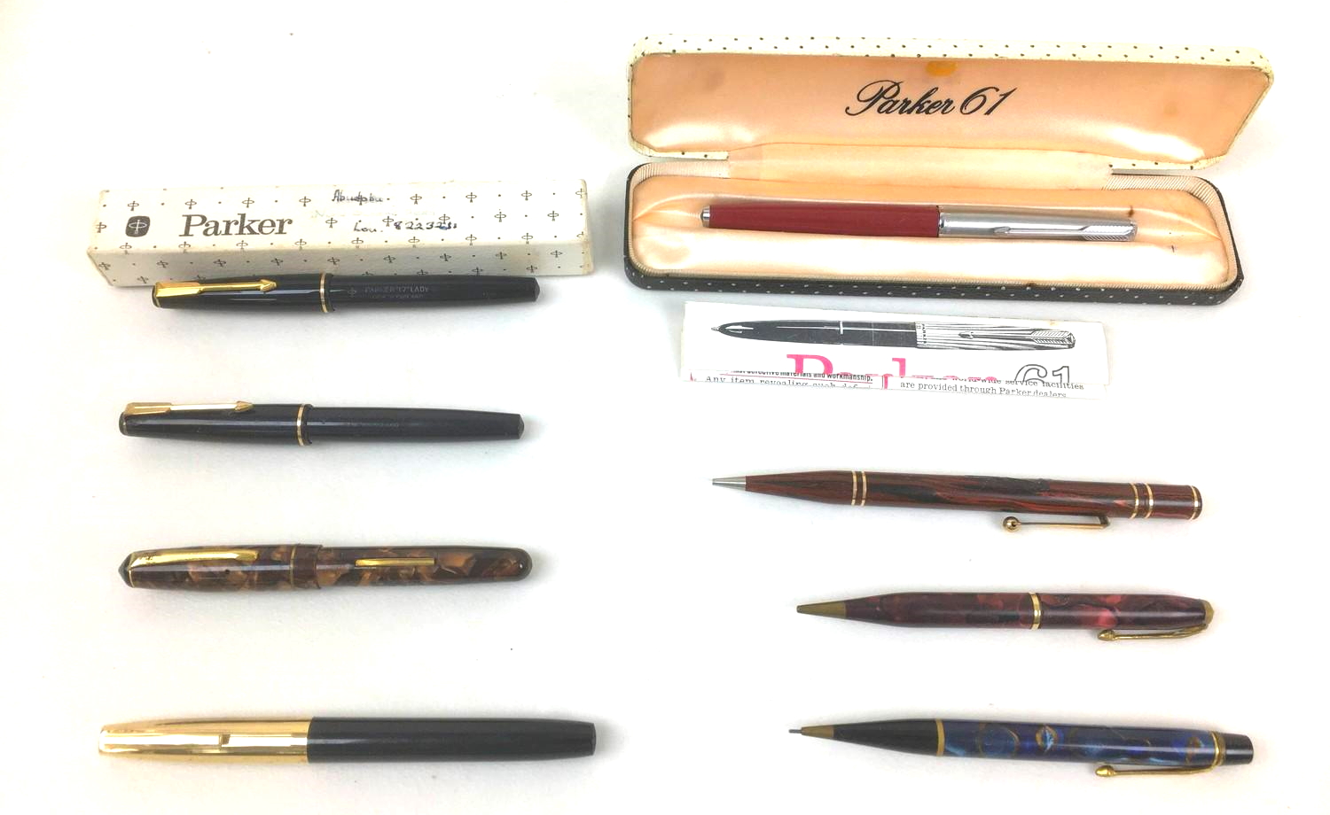 Five vintage fountain pens, comprising a Parker 61, two Parker '17' Lady pens, one boxed, a