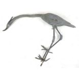 A life size lead Heron garden ornament, 103 by 20 by 70cm high.