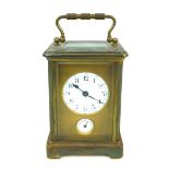 An early 20th century Charles Such & Co. carriage clock with alarm, an enamel Arabic dial with