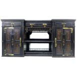 A Victorian Gothic breakfront sideboard, ebonised and gilt highlighted, three frieze drawers with