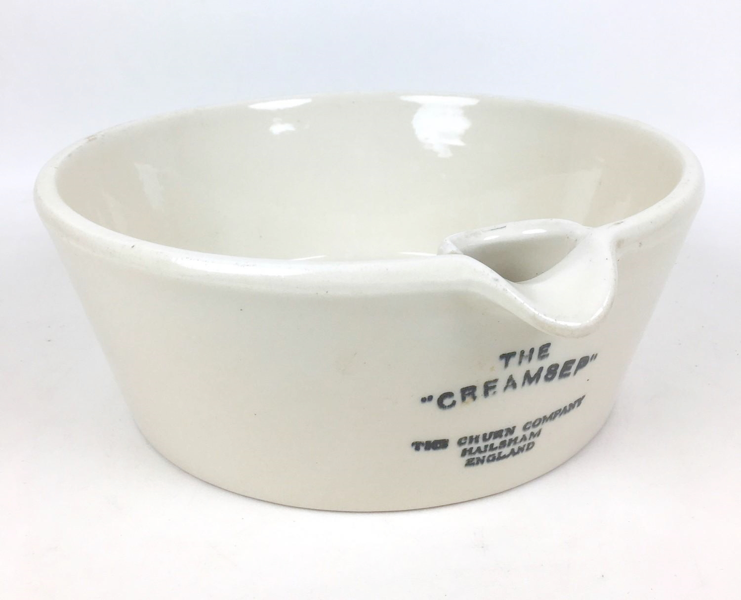 A 'Creamsep' cream separating pan by 'The Churn Company Hailsham England', Doulton, 30 by 28 by 10cm