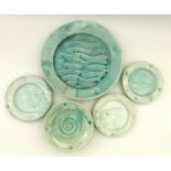 A small group of North Shore pottery with an aquamarine glaze, one bowl, three small plates and, one