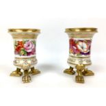 A pair of early 19th century Coalport style porcelain spill vases, each with cylindrical form with