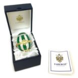 A limited edition Faberge Emerald Princess Surprise egg by Limoges, with hand painted decoration,