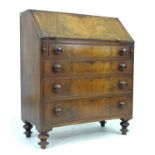 A Victorian mahogany bureau, fall front and fitted interior with five drawers with bone handles,